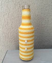 Garrafas decoradas com barbante ou lã