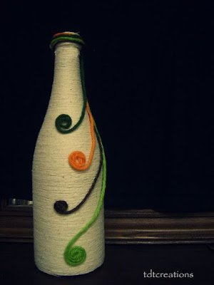 Garrafas decoradas com barbante ou lã